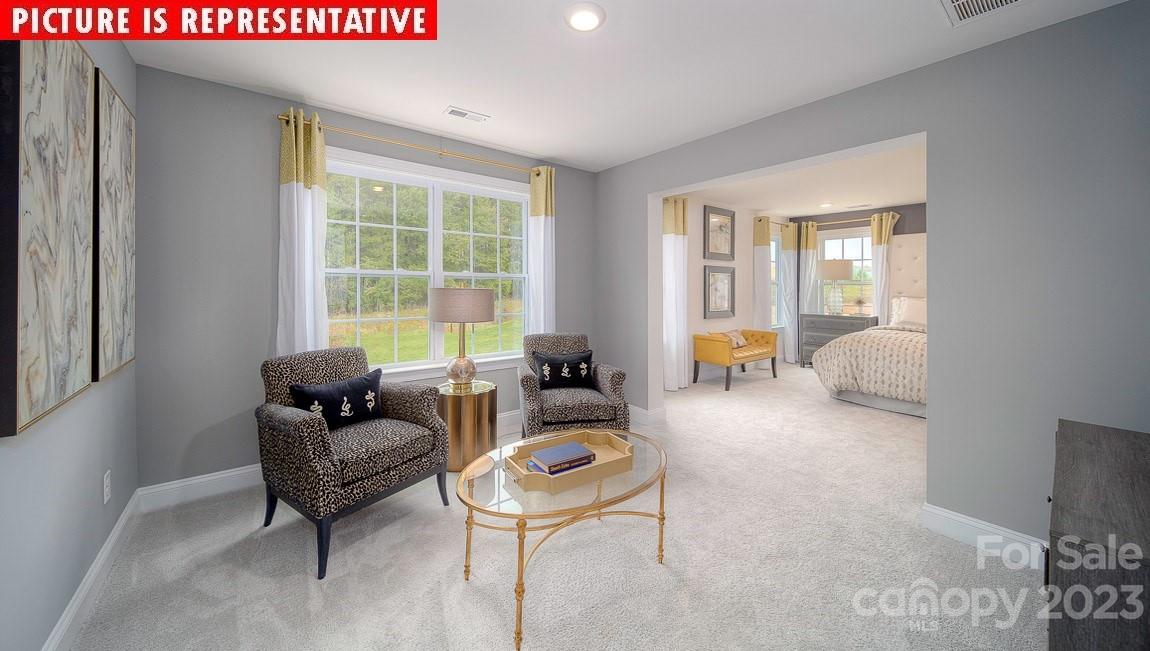 309 Streamwood Road Troutman, NC 28166 - Photo 19 of 47 a living room with furniture and a large window