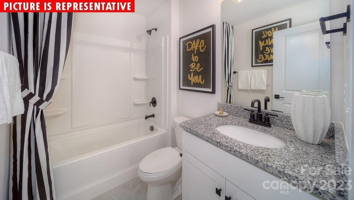309 Streamwood Road Troutman, NC 28166 - Photo 29 of 47 a bathroom with a granite countertop sink toilet and shower