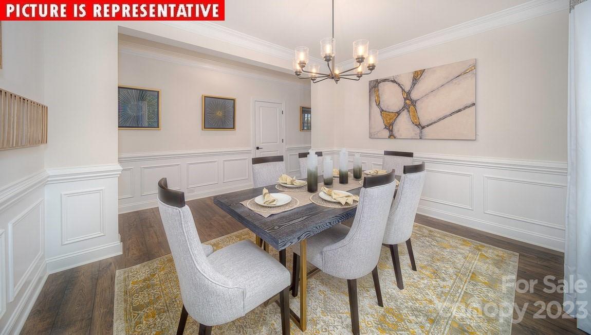 309 Streamwood Road Troutman, NC 28166 - Photo 5 of 47 a view of a dining room with furniture and chandelier