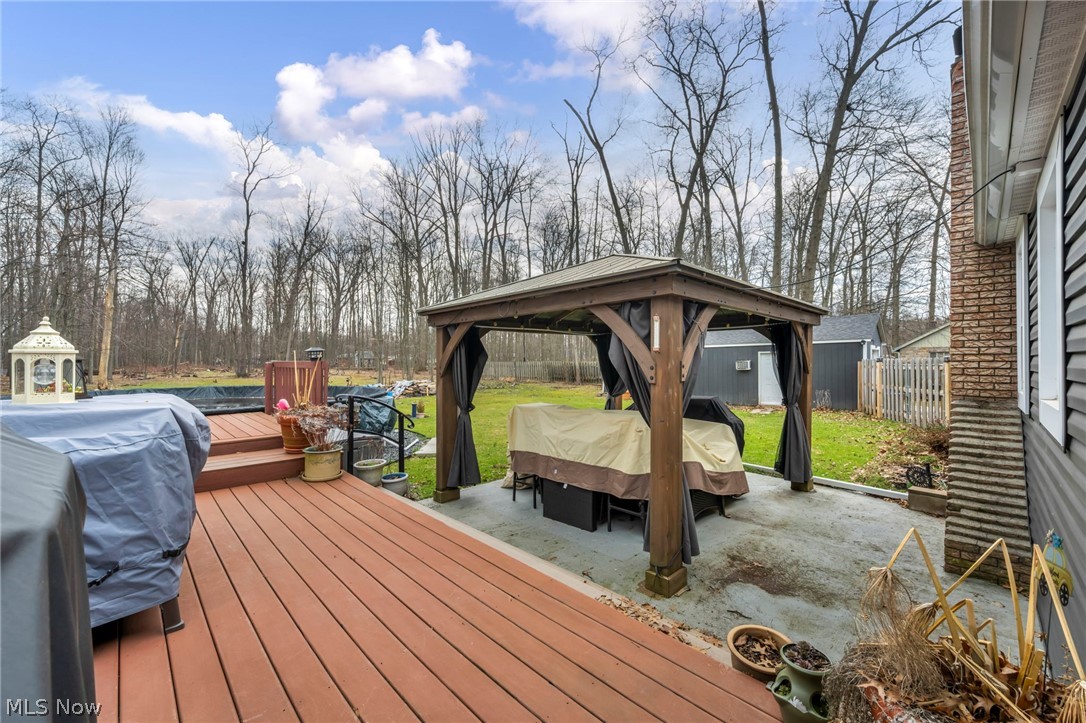 9753 Prospect Road Strongsville, OH 44149 - Photo 30 of 39 Wooden terrace featuring a gazebo, a patio, and a fenced backyard