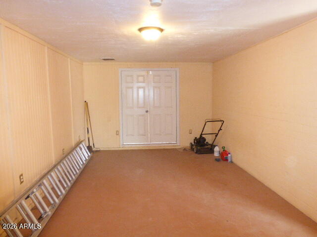 303 Greenwich Road Kearny, AZ 85137 - Photo 10 of 18 a view of a room with gym equipment and wooden floor