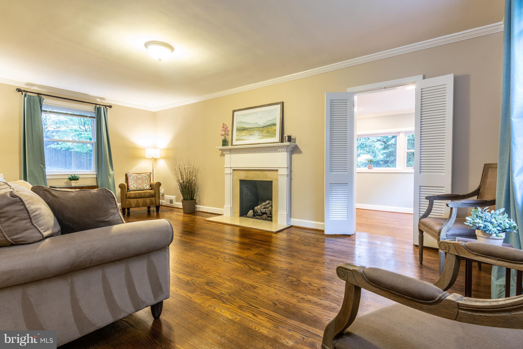 400 East Schuyler Road Silver Spring, MD 20901 - Photo 11 of 30 Big living room: gas fireplace, gleaming hardwoods