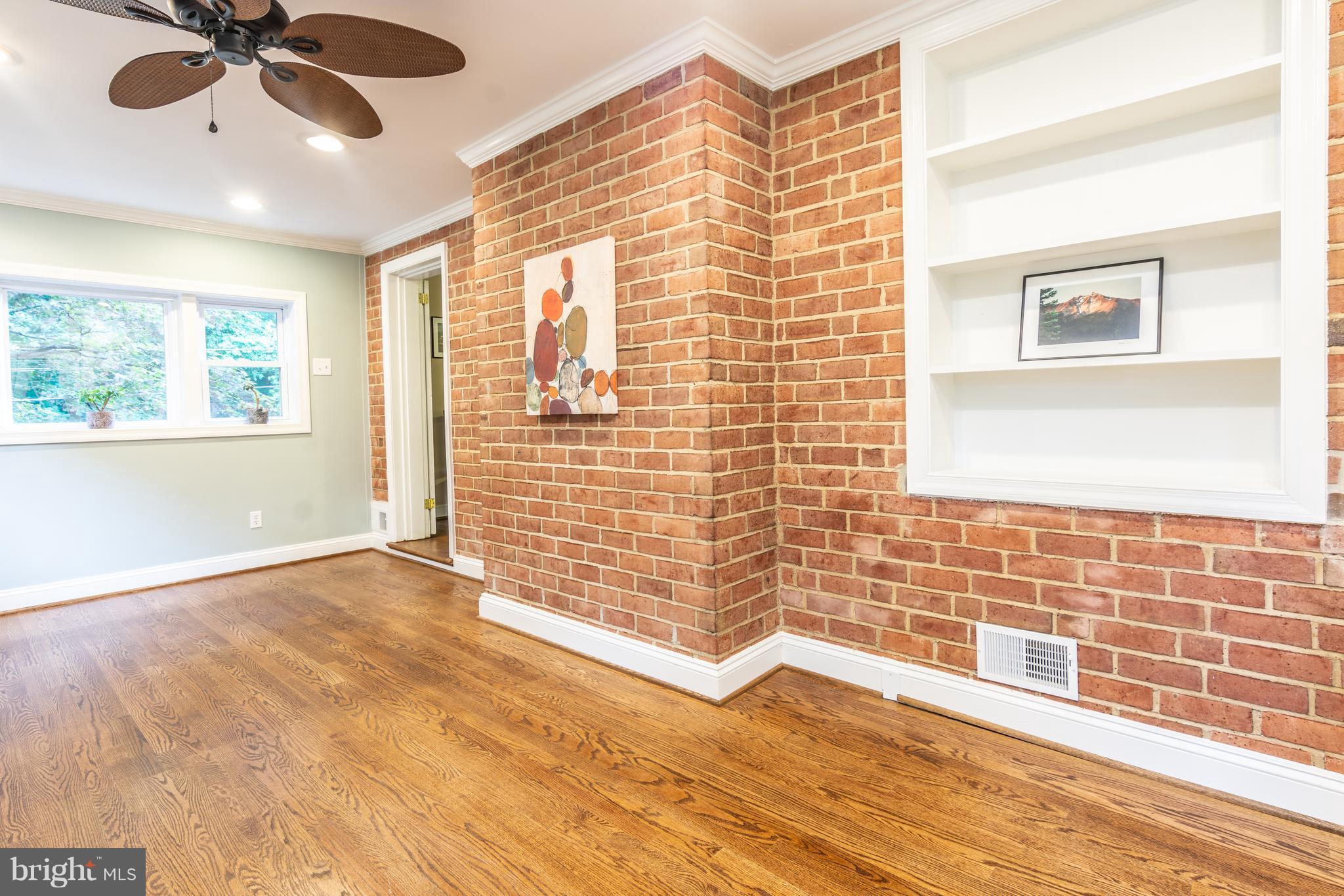 400 East Schuyler Road Silver Spring, MD 20901 - Photo 13 of 30 Bonus sunroom: exposed brick, hardwoods, built-ins