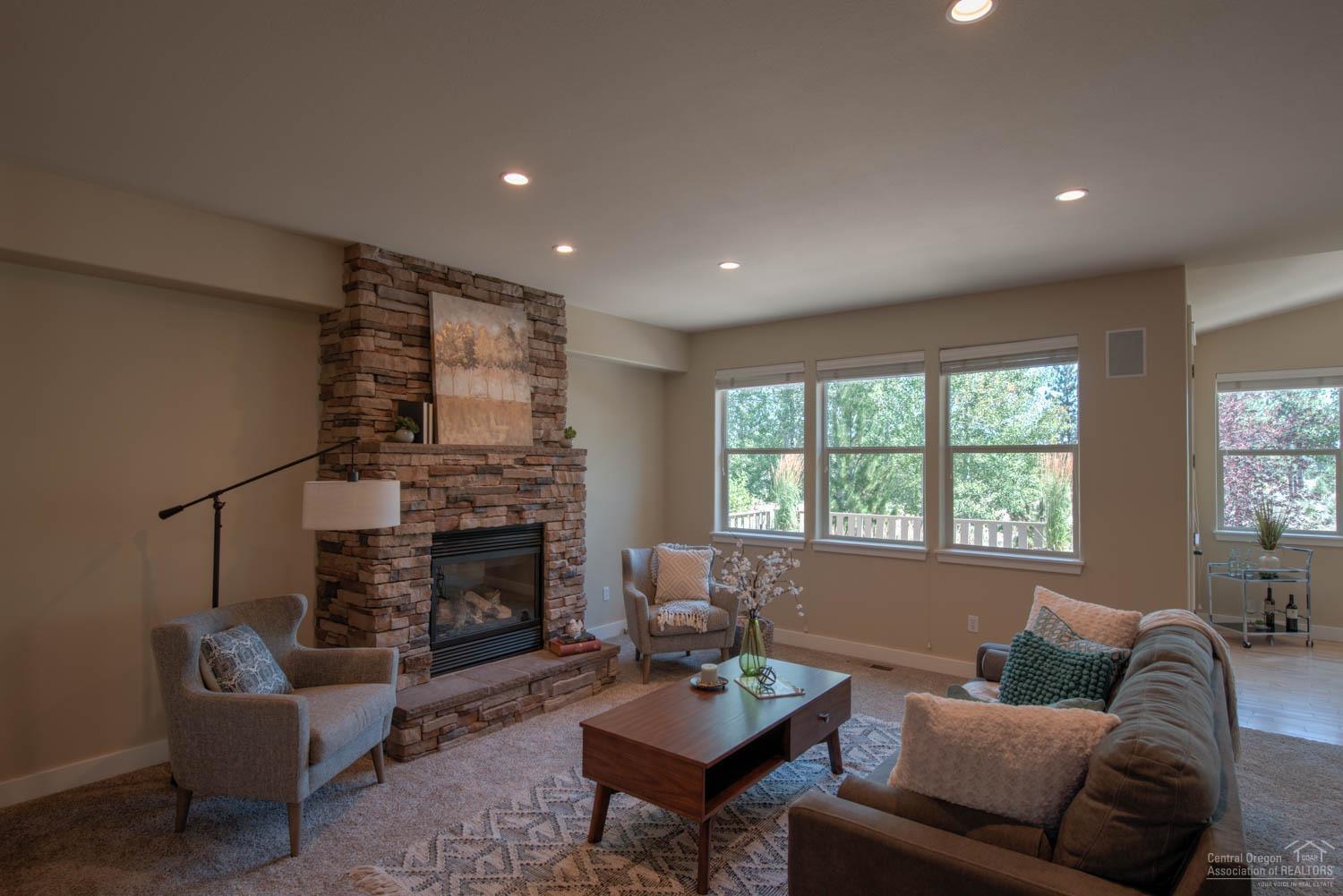 61915 Fall Creek Loop Bend, OR 97702 - Photo 4 of 24 The family room features a handsome gas