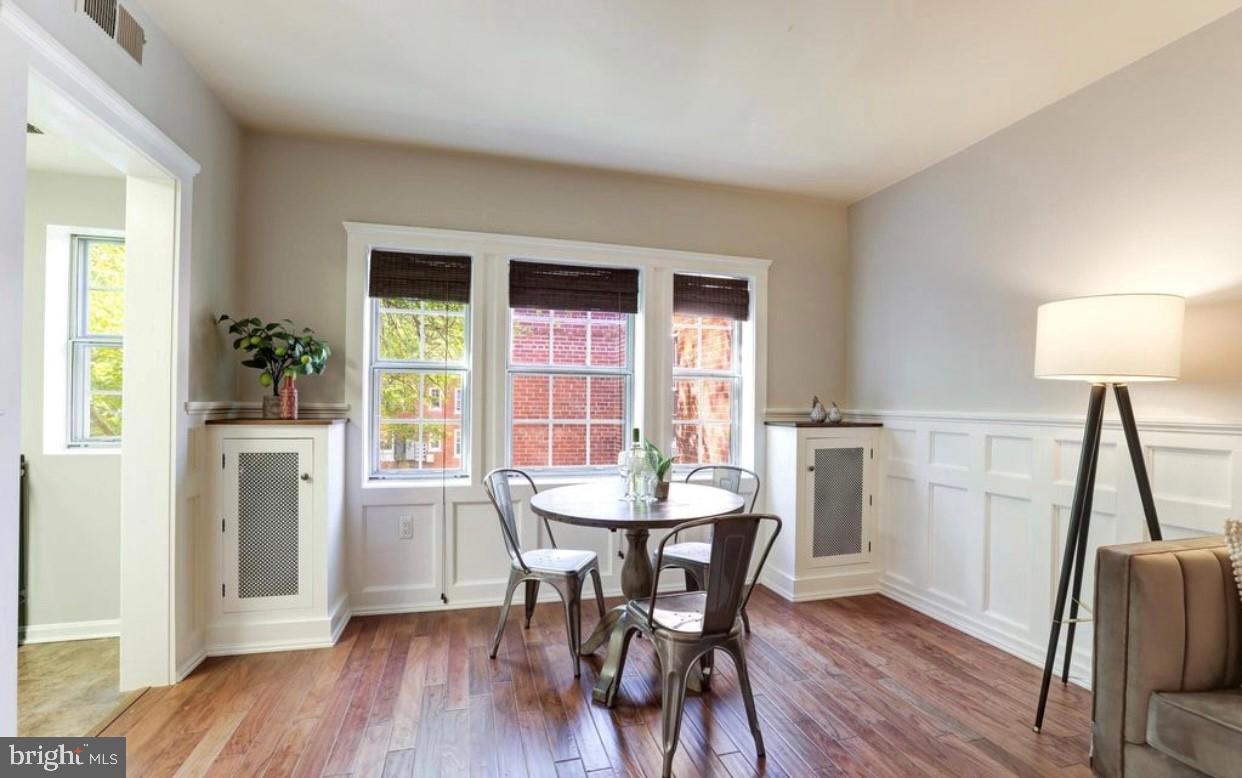 1742 North Rhodes Street, Unit 5304 Arlington, VA 22201 - Photo 5 of 11 a view of a dining room with furniture and a window