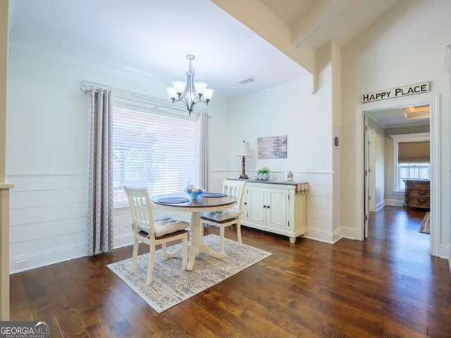 a spacious bathroom with a tub sink and mirror