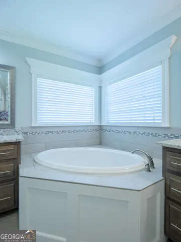 a living room with furniture and a ceiling fan