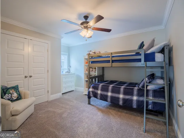 an aerial view of a house with outdoor space and lake view