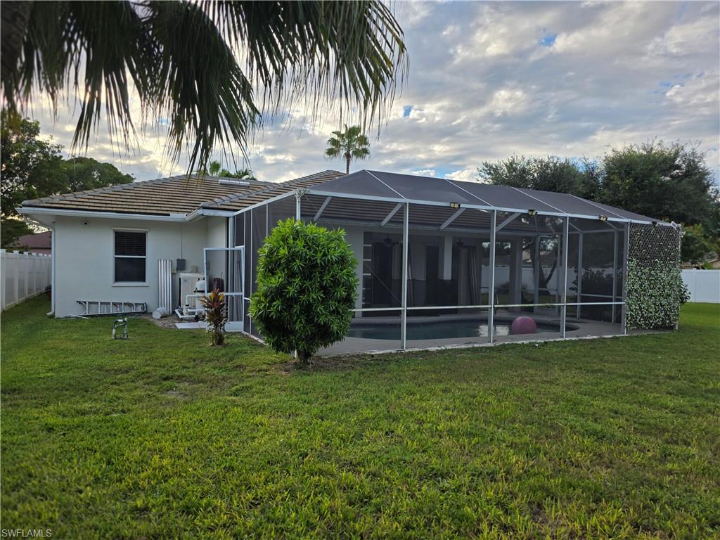 857 Summerfield Drive Naples, FL 34120 - Photo 14 of 50 a view of a backyard with a garden