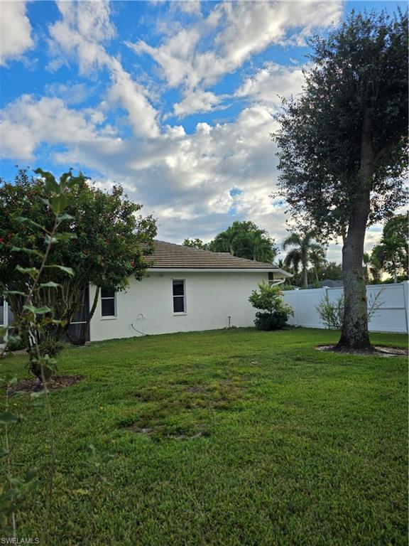 857 Summerfield Drive Naples, FL 34120 - Photo 17 of 50 a view of a house with a yard