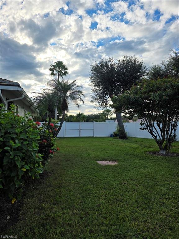 857 Summerfield Drive Naples, FL 34120 - Photo 18 of 50 a view of a backyard with garden