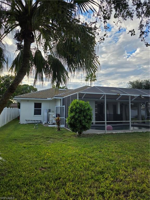 857 Summerfield Drive Naples, FL 34120 - Photo 20 of 50 front view of a house with a yard