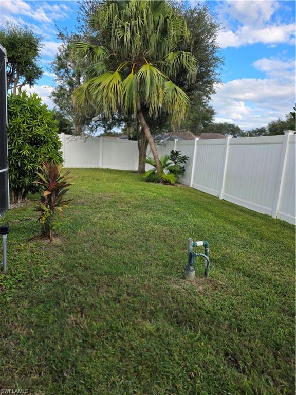 857 Summerfield Drive Naples, FL 34120 - Photo 21 of 50 a view of a backyard