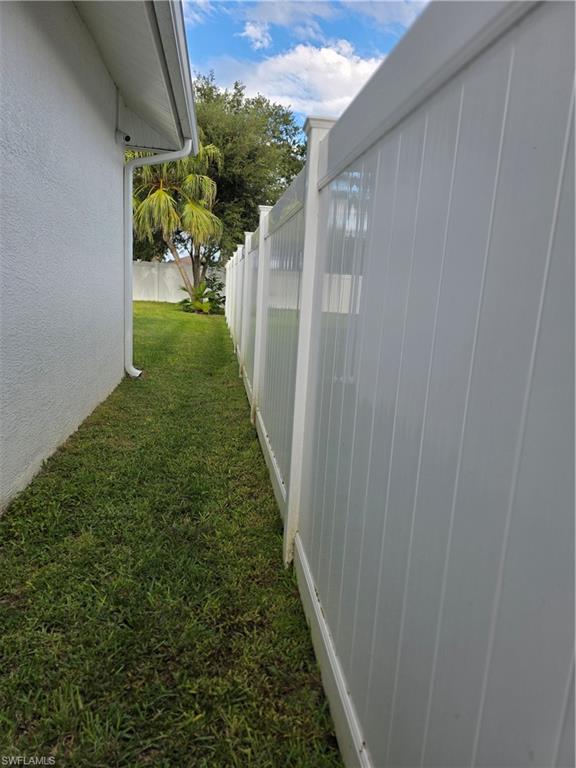 857 Summerfield Drive Naples, FL 34120 - Photo 22 of 50 a view of a yard from a balcony