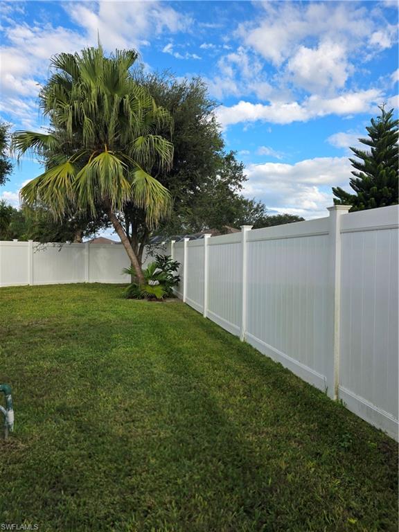 857 Summerfield Drive Naples, FL 34120 - Photo 23 of 50 a view of a backyard