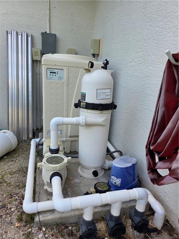 857 Summerfield Drive Naples, FL 34120 - Photo 25 of 50 a living room with furniture and a mirror