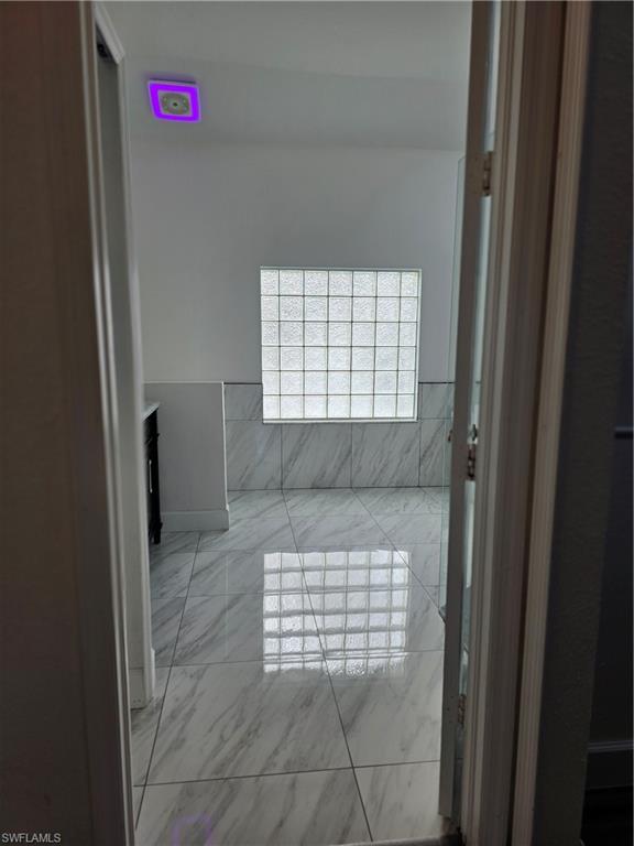 857 Summerfield Drive Naples, FL 34120 - Photo 27 of 50 a bathroom with a bathtub and a shower