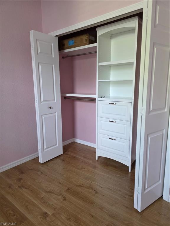 857 Summerfield Drive Naples, FL 34120 - Photo 35 of 50 a view of walk in closet with empty racks