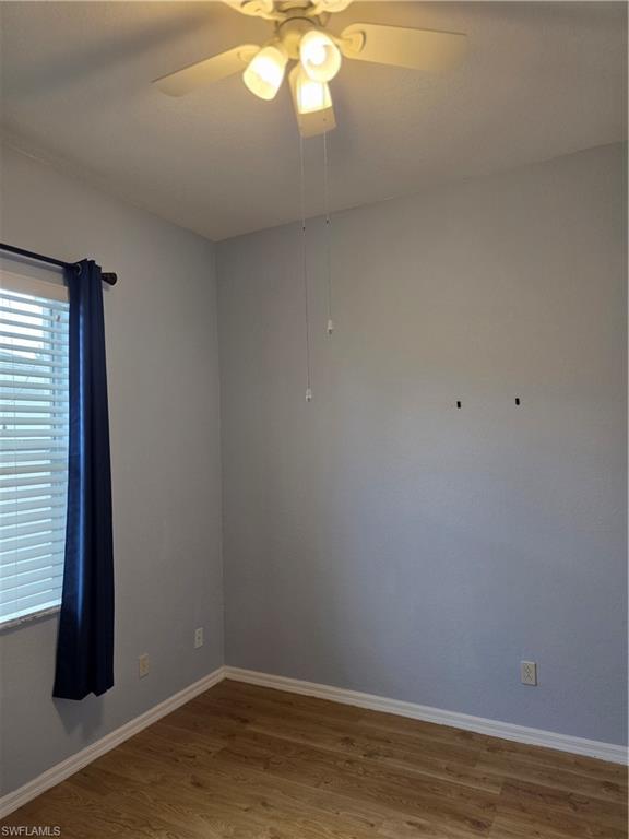 857 Summerfield Drive Naples, FL 34120 - Photo 38 of 50 a view of a small space with wooden floor and fan