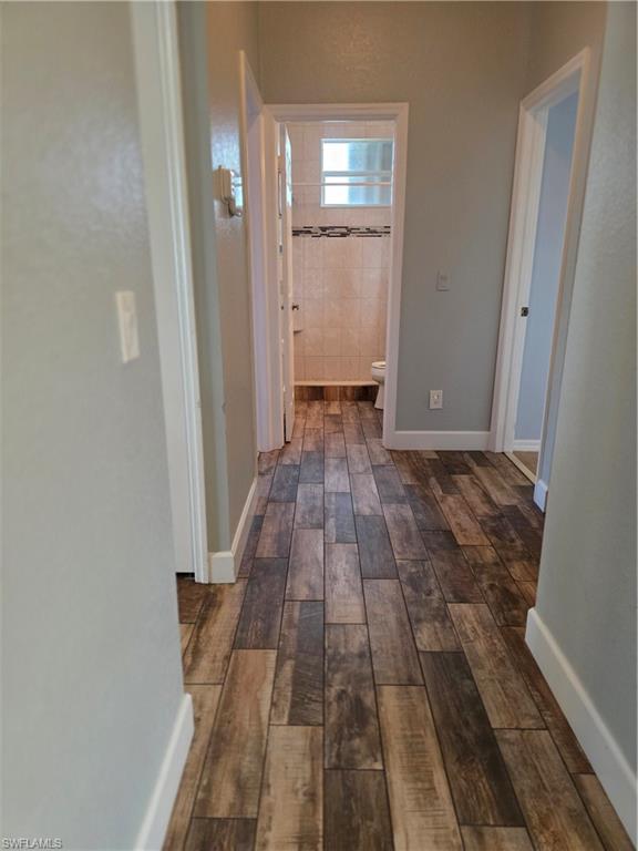 857 Summerfield Drive Naples, FL 34120 - Photo 39 of 50 a view of a room with wooden floor