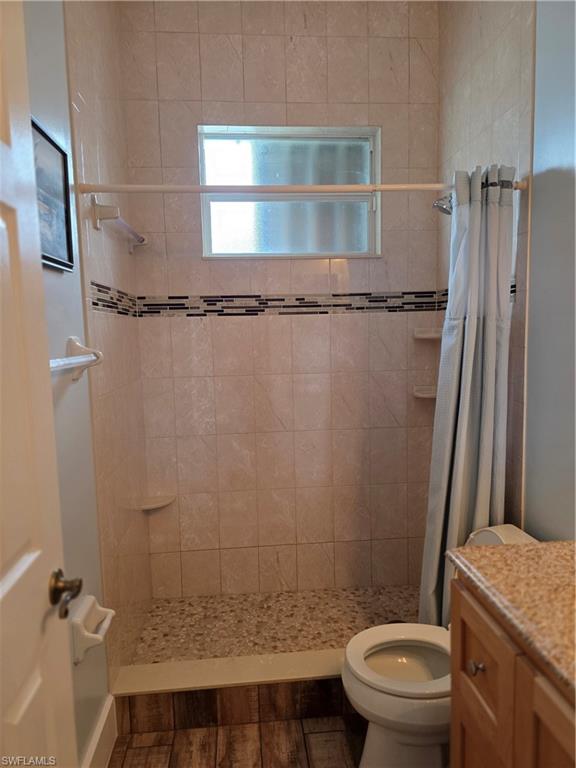 857 Summerfield Drive Naples, FL 34120 - Photo 40 of 50 a bathroom with a granite countertop bathtub shower sink vanity and toilet