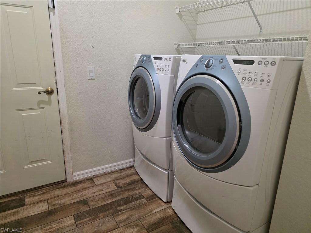857 Summerfield Drive Naples, FL 34120 - Photo 42 of 50 a utility room with dryer and washer