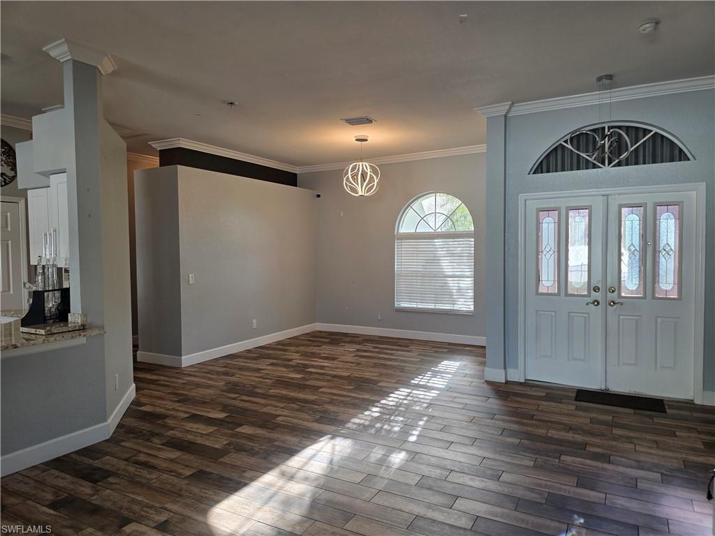 857 Summerfield Drive Naples, FL 34120 - Photo 45 of 50 a view of livingroom with window and hardwood floor