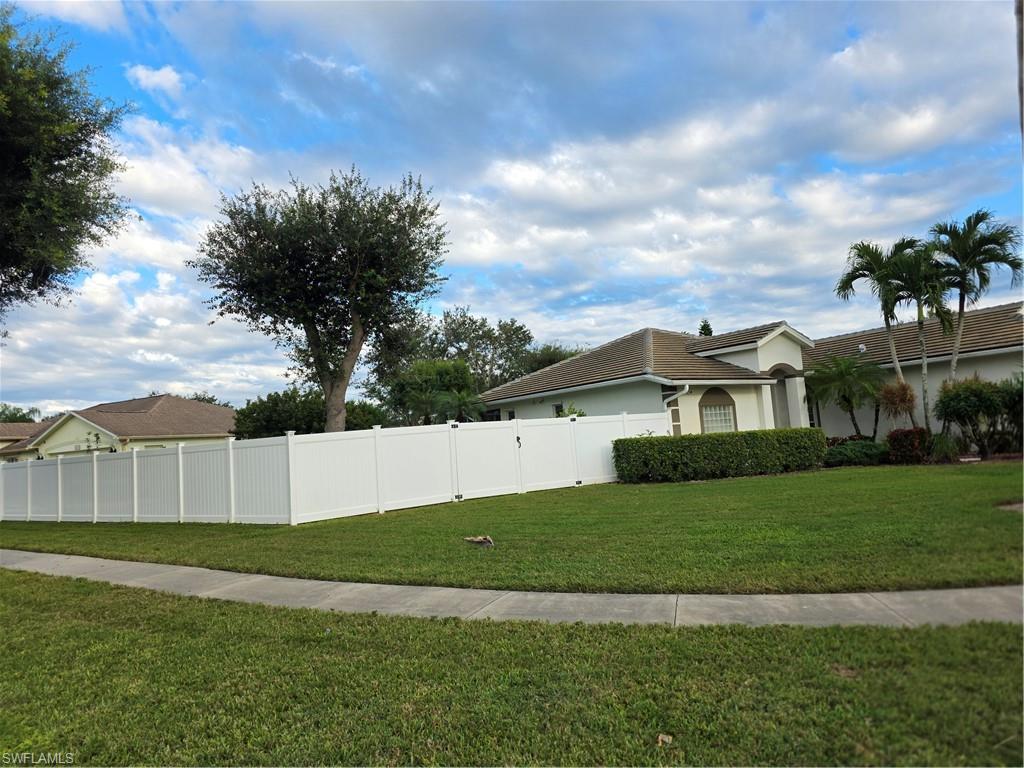 857 Summerfield Drive Naples, FL 34120 - Photo 6 of 50 a view of a yard in front of a house