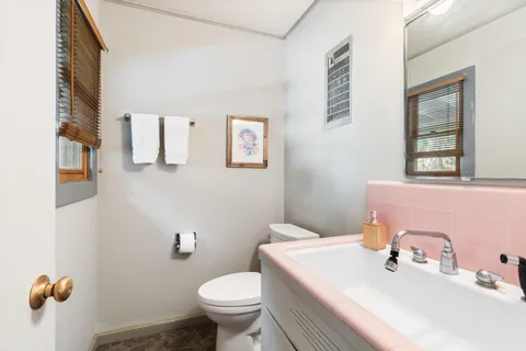 a sign broad on the side of the tree