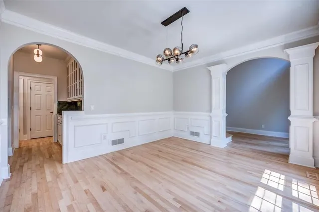 a view of a livingroom with a furniture wooden floor and a ceiling fan