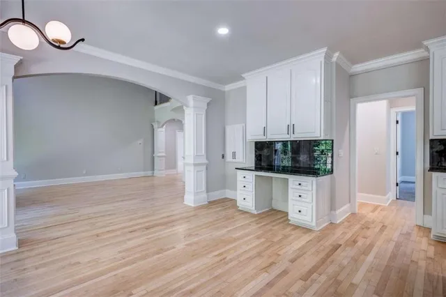 a view of a livingroom with furniture and wooden floor