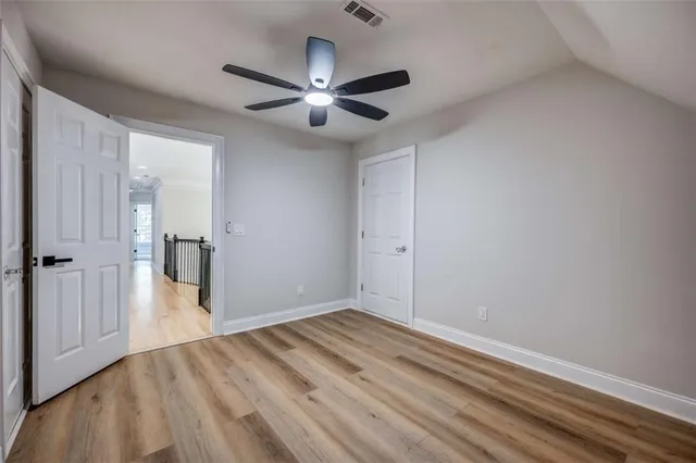 a room with a sink and cabinets