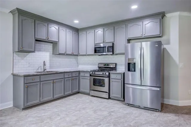 a view of empty room with a fireplace