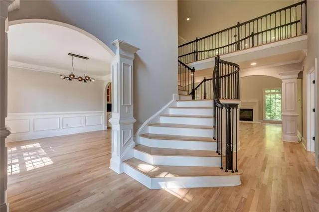 a view of entryway and hall with wooden floor
