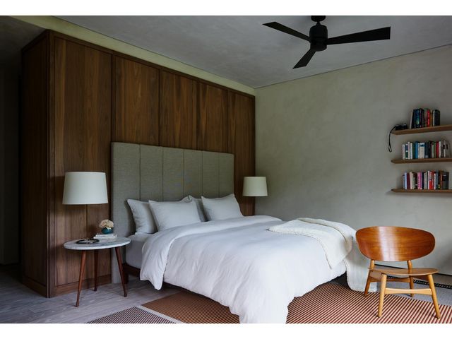 a view of backyard of the house with outdoor seating