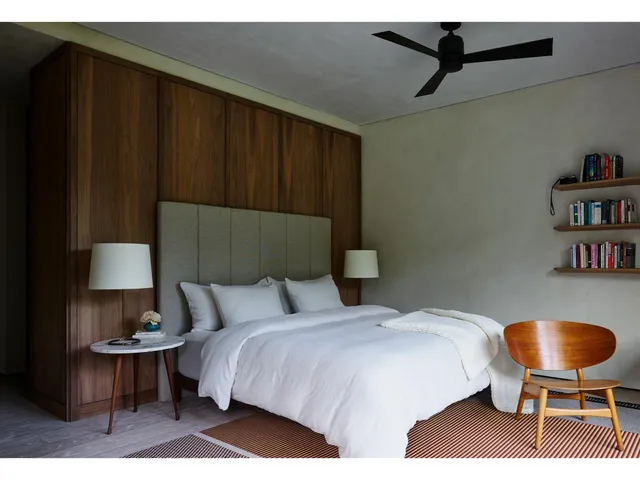 a view of backyard of the house with outdoor seating