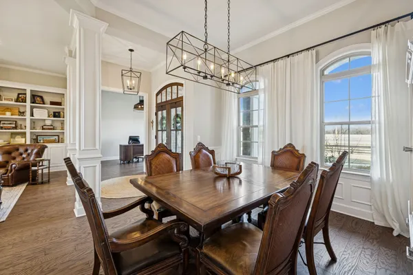 a kitchen with a refrigerator a sink and cabinets