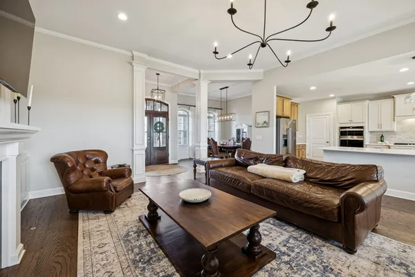 a spacious bathroom with a double vanity sink a mirror and a bathtub