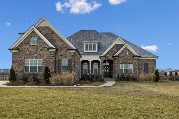 a front view of a house with a yard