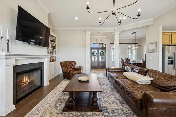 a spacious bathroom with a double vanity sink a mirror and a shower