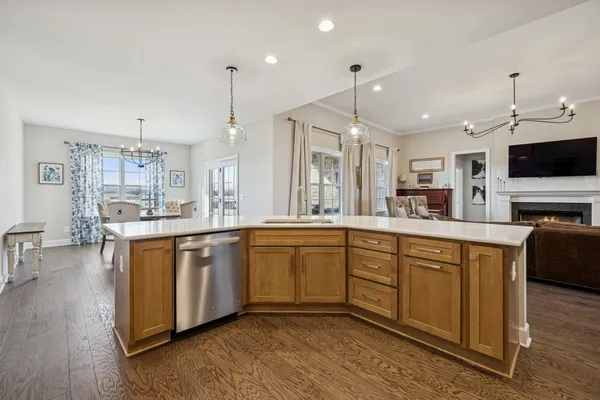 a bedroom with a bed and dresser with mirror