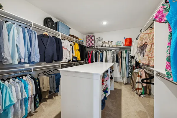 a view of a swimming pool with a lounge chair