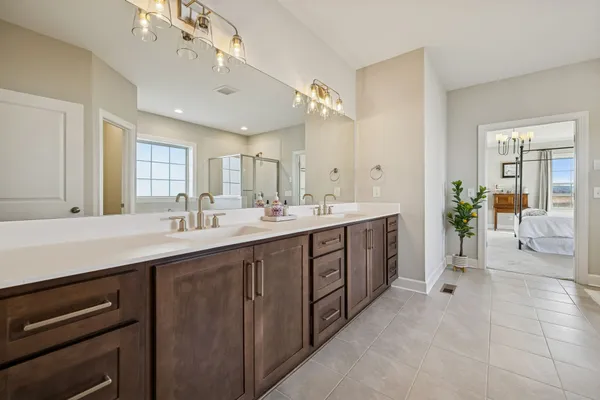 a aerial view of a house with outdoor space and lake view