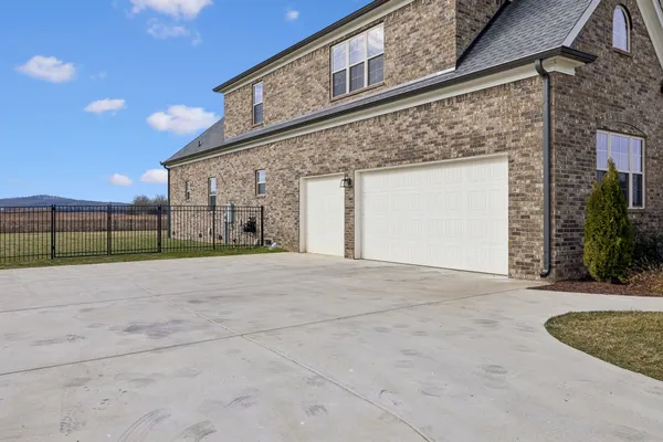 a view of a dining room with furniture a chandelier and wooden floor