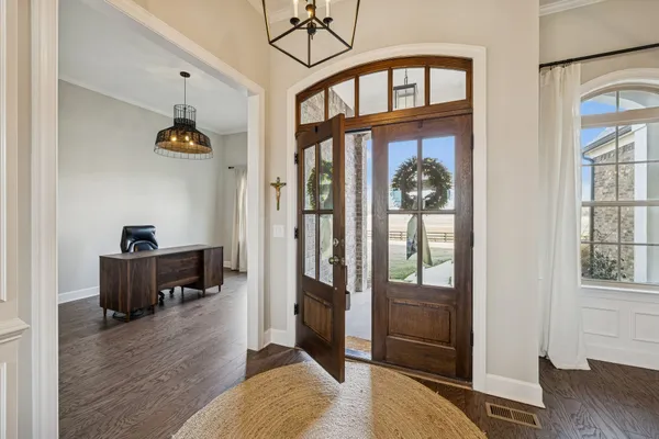 a living room with furniture fireplace and a flat screen tv