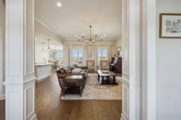 a living room with furniture fireplace and flat screen tv