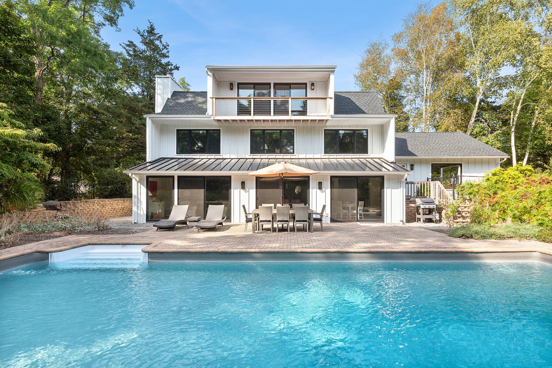 1 Ward Road Shelter Island, NY 11964 - Photo 1 of 17 a front view of a house with garden