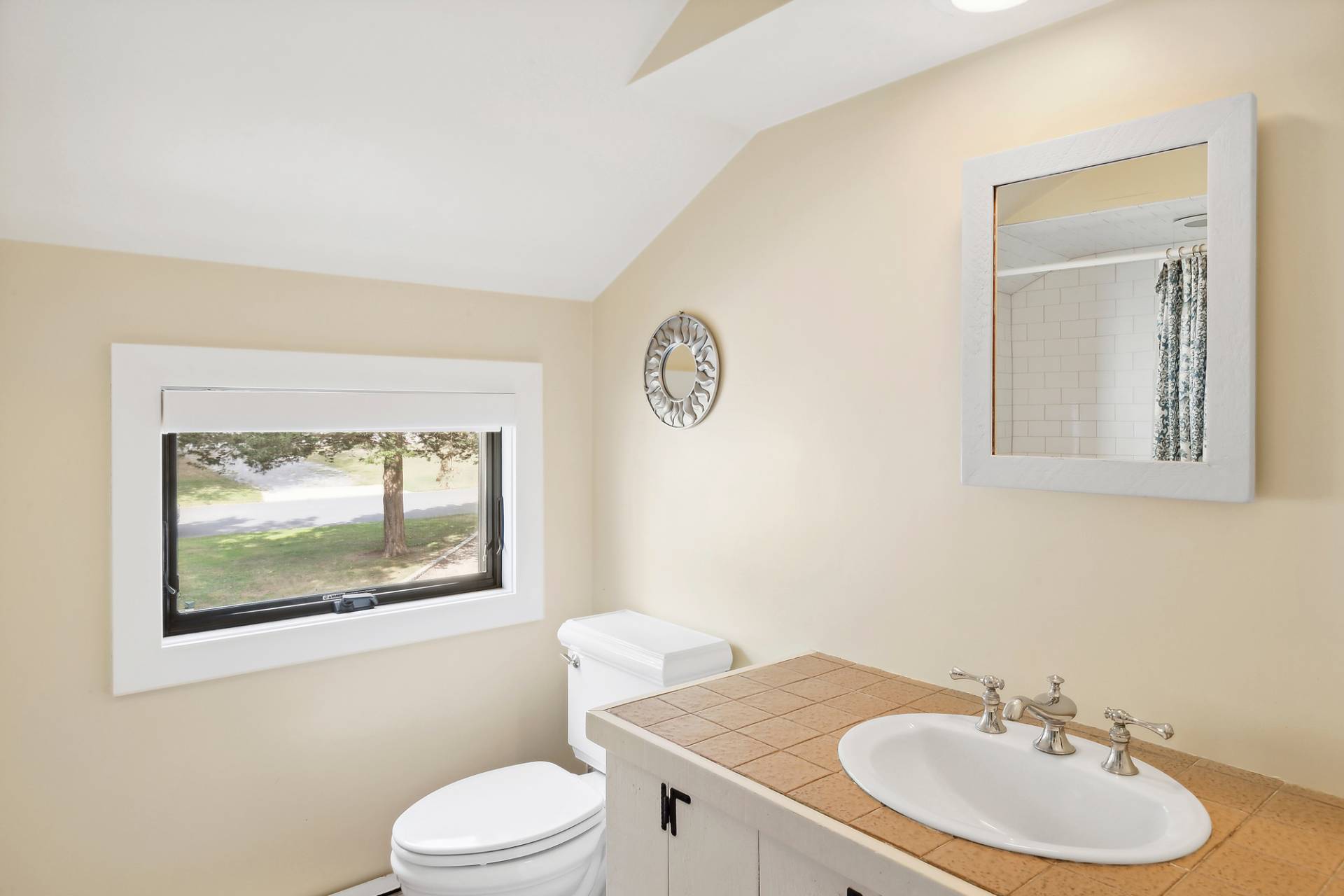 1 Ward Road Shelter Island, NY 11964 - Photo 5 of 17 a bathroom with a toilet a sink and mirror