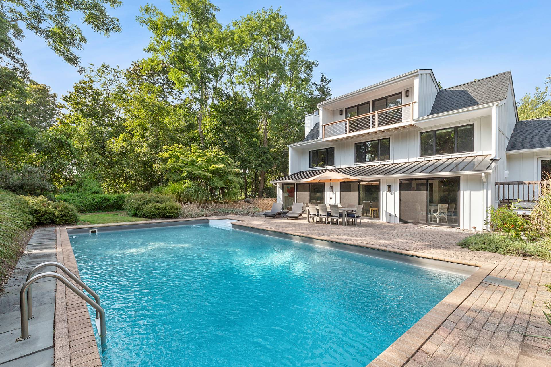 1 Ward Road Shelter Island, NY 11964 - Photo 8 of 17 a view of a house with a swimming pool