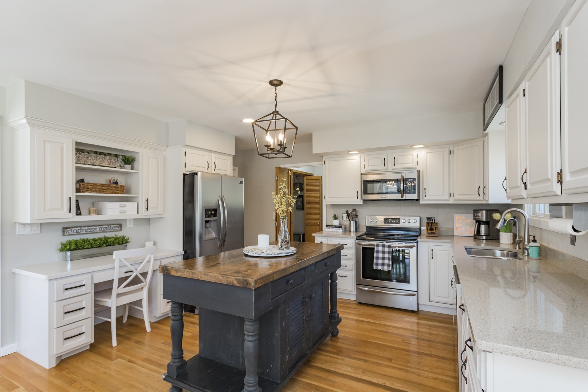 804 High Point Ridge Road Franklin, TN 37069 - Photo 17 of 50 a large kitchen with stainless steel appliances kitchen island granite countertop a stove refrigerator and cabinets